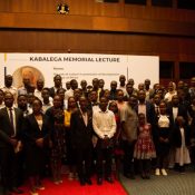 A cross-section of students and some of the participants who took part in the lecture posing for a photo with Prof. PLO. Lumumba