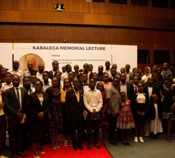 A cross-section of students and some of the participants who took part in the lecture posing for a photo with Prof. PLO. Lumumba